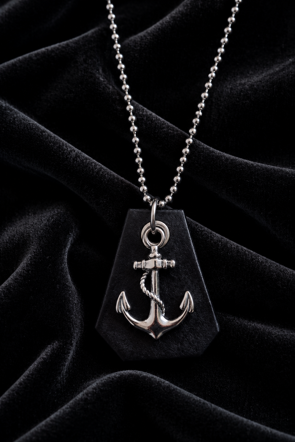 Anchor pendant necklace styled on black velvet