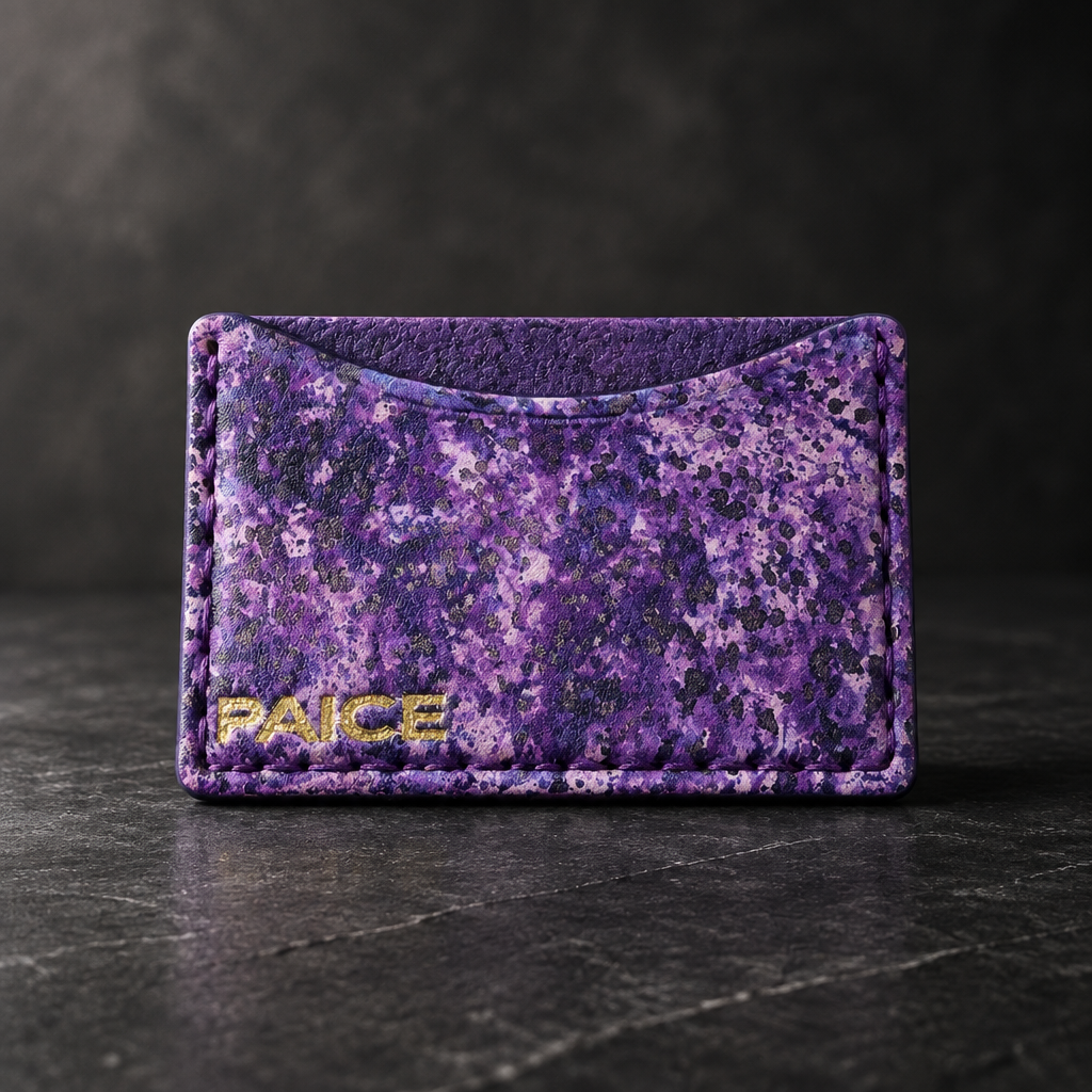 Purple marbled PAICE card wallet photographed on dark charcoal stone