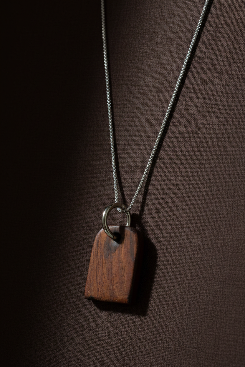Wood pendant necklace on espresso linen